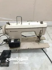  1 مكينه خياطه تشتغل كلشي ما بيها