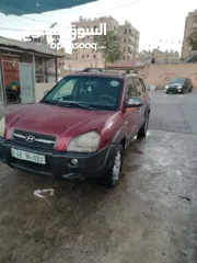  1 جيب هونداي توسان موديل 2007 ماطور 2000 لون خمري كام لا ينقصه شيئ