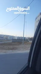  5 ارض للبيع في جاوا على شارع مادبا تقع على شارعين