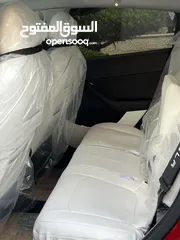 14 تيسلا Y 2022 performance لون خمري مميزة داخلي ابيض الاداء العالي دفع رباعي وبسعر مغري جداً جمرك جديد
