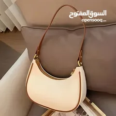  1 حقيبة يد فرنسية فاخرة - تصميم نصف قمر بسحاب عملي – لون بيج أنيق