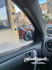 23 كيا فورتي احمر فل كامل مع فتحة بحالة ممتازة... للبيع