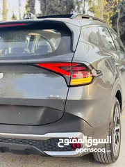  17 كيا سبورتاج هايبرد 2023 فل كامل مع بانوراما - باللون المميز والداخلية المميزة - والسعر المميز