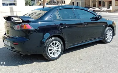  5 متسوبيشي لانسر فراشة موديل 2015 فحص مرفق مع الصور بحالة الوكاااااالة  ماشية 49 الف km  أصلي