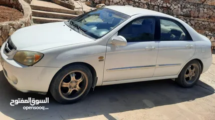  1 كيا سيراتو 2006 ماتور 1600 اوتومات. دهان اصلي مع تصليح عيوب بسيطة في البودي