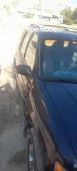  3 كيا سبورتاج موديل 2000 لون كحلي