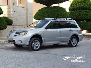  13 ميتسوبيشي آوتلاندر اوتوماتيك 2003 توب نظافة بسعرررر مميززز محرك 2400cc