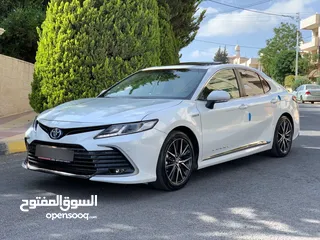  22 تويوتا كامري هايبرد 2024 بحال الوكاله أعلى صنف 7 جيد