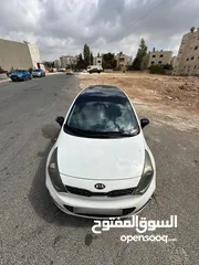  12 كيا برايد هاتش باك موديل 2014 فحص 4 جيد سعة الموتور 1600 سي سي الشكل رياضي لون ابيض سقف اسود