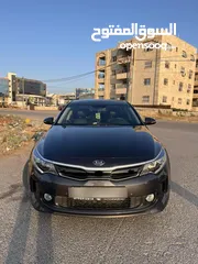  5 كيا K5 هايبرد موديل ال 2018 لون فيراني ميتالك  فحص اربعة جيد ولا ملاحظة فل كامل عدا الفتحة - كاش