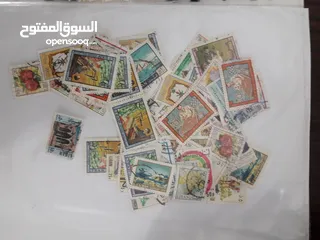  12 طوابع قديمة منذ اكثر من 50 عام