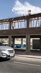  2 محلات عدد 2 عند دوار العلم الشارع الجديد