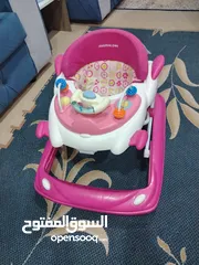  1 كراجة عرباية تعلم المشي للأطفال بحالة جيدة جدا ومعها كوت اهتزاز وثابت هدية