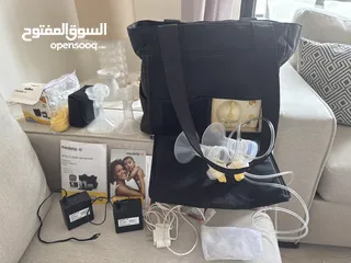  1 Medela pump in style شفاطة حليب إلكترونية