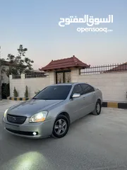  14 كيا لوتزي 2006 3 جيد لون سلفر ماتور 2000cc