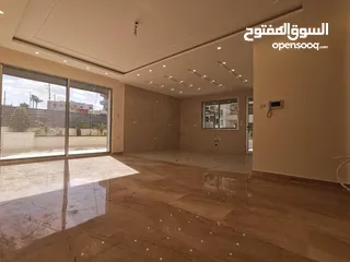  4 شقة ارضيه 210 م وحديقه وكراج 300 م في اجمل مناطق قرية النخيل