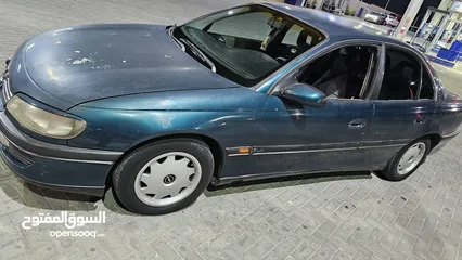  23 اوبل اوميجا للبيع السياره ب حاجه ل صيانه (القير + صنوبرصات) كاوشك جديد كراسي كهرباء السياره فحص خالي