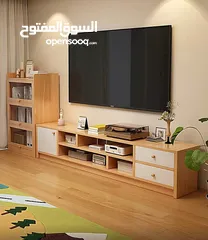  11 خزانة مزنزن تلفزيون خشبية عصرية تصميم أنيق يجمع بين الخشب الطبيعي والأبواب البيضاء ليضيف لمسة .