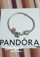  2 PANDORA Silver bracelet with heart-shaped clasp with some charms سوار باندورا فضة بشكل قلب مع إضافات