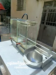  5 طاولات ستانلس وعرباية عصير