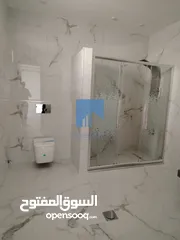  4 شقة أرضية فاخرة للبيع في خلدا  - خلف المستشفى السعودي 330م مع حديقة وترسات 100م لم تسكن