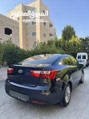  7 كيا ريو 2014 متور 1250 بنزين جير عادي فحص ممتاز  لون كحلي فرش بيج تحكم ستيرنج