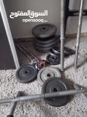  1 اوزان دامبل و بار و تخت  مستعملة للبيع