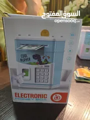  2 حصّالة إلكترونية ذكية بنك صغير في بيتك تسحب الورقة لحالها قدام عيونهم قفل برقم سري بصمة .