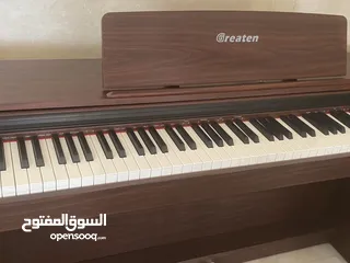  1 Greaten piano new model amazing brownish black color no key broken functioned with metronome