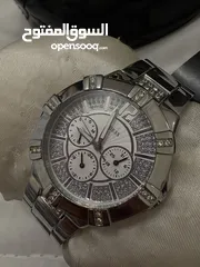  2 ساعه guess اصليه لون فضي