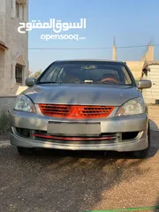  1 لانسر قير عادي متور 1300 فحص 2 جيد