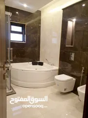  12 شقة 550م مع رووف طابقية مطلة للبيع في ضاحية الامير راشد
