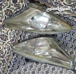  1 Nissan Tida 2014 headlights original used aed 120