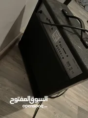  6 Electric guitar(Black and white) and Amplifier.  غيتار كهربائي(اسود و ابيض) و مكبر للصوت