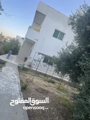  22 ارض دونم مع بيت ارضي وبيت طابقين