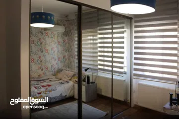  11 شقة مع روف دوبلكس للبيع في حي الصحابة - ref: 14581