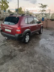  4 جيب هونداي توسان موديل 2007 ماطور 2000 لون خمري كام لا ينقصه شيئ