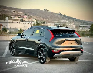  11 كايا نيرو  هايبرد (بنزين+كهرباء ) فل الفل فتحة سقف  /2022 عداد قليل 18000Km