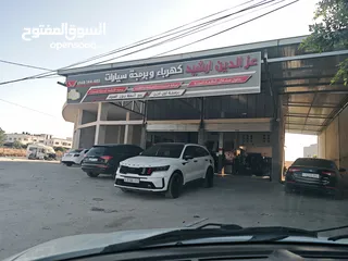  15 كراج عزالدين ارشيد متخصص في برمجة السيارات الحديثة ومختص في صيانة الهايبرد