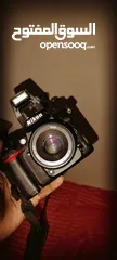  6 Nikon D7000 with 50mm 1.8F lens مع البطارية والشاحن وعدسه شبه جديده
