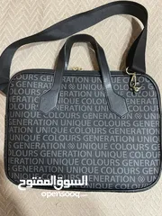  2 شنته لابتوب والاوراق جديده