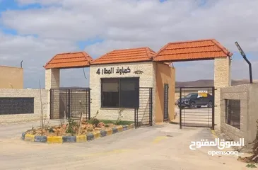  1 أرض بمساحة 3600m على طريق المطار ضمن كومباوند المطار 4