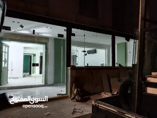  14 تفصيل تنفيذ وصيانة ابواب واجهات السيكوريت بافضل جوده ووقت وسعر