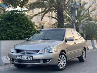  23 ميتسوبيشي لانسر  موديل 2011 GLX ماتور 1600  اصلي وارد الكويت بختم الوكيل الملا الاصلي. فحص كامل