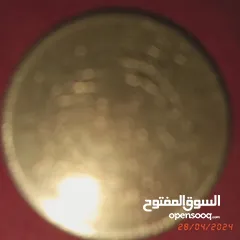  21 عملات نقدية قديمة تونسية وغير تونسية وساعة جيب ألمانية و مغارف سبولة مطبوعئن ومفتاح قديم