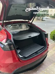  10 تيسلا Y 2022 performance لون خمري مميزة داخلي ابيض الاداء العالي دفع رباعي وبسعر مغري جداً جمرك جديد