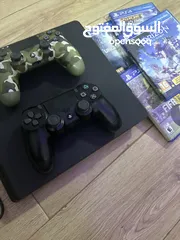  2 PlayStation 4 with 2 controllers and 5 games