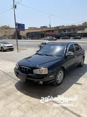  1 هيونداي افانتي xD لون اسود مميز ميتالك  موديل 2000