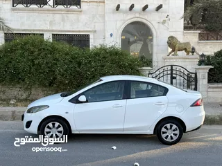  6 مازدا زوم 2 موديل 2012 فحص كامل 7 جيد ولا ملاحظة لون ابيض قاطعة مسافة 100 الف كيلو فقط (استخدام شخصي