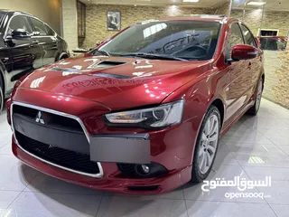  13 ميتسوبيشي لانسر موديل 2015 GT اصلي فحص كامل بحالة الوكاله فل كامل اعلى صنف من فئتها